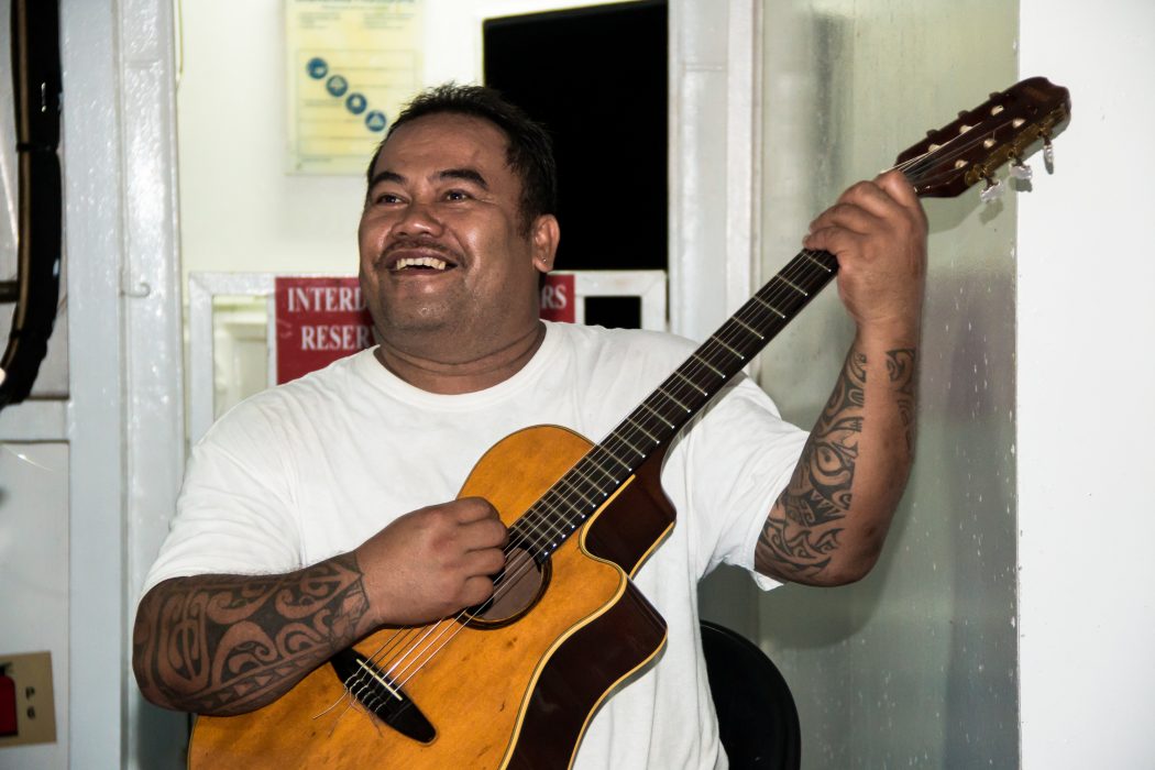 Marquisian playing the guitar